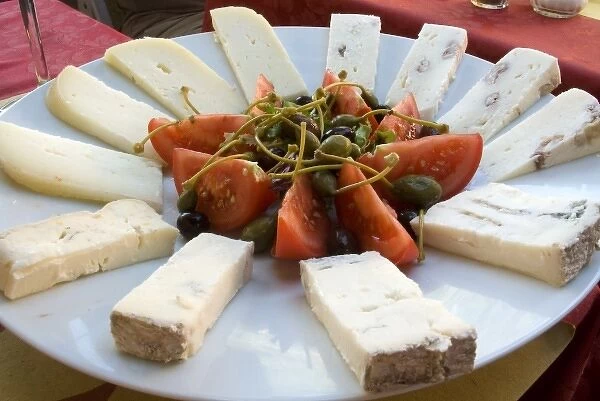 Italy, Vernazza. Antipasti dish of cheese, tomatoes, and capers