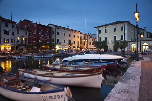 ITALY, Verona Province, Lazise. Old boat harbor, evening