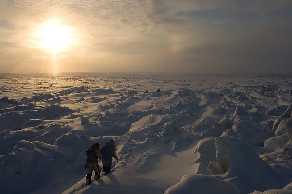 Jack Kayotuk and Alice Faith on frozen landscape on the Arctic ocean, off Herschel island