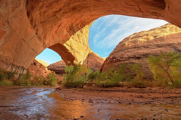 Jacob Hamblin Arch seen from beneath adjacent giant sandstone in Coyote Gulch, Glen Canyon National Recreation Area, Utah