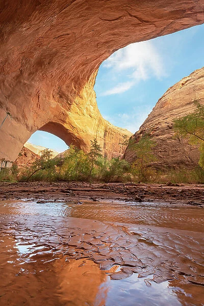 Jacob Hamblin Arch seen from beneath adjacent giant sandstone in Coyote Gulch, Glen Canyon National Recreation Area, Utah