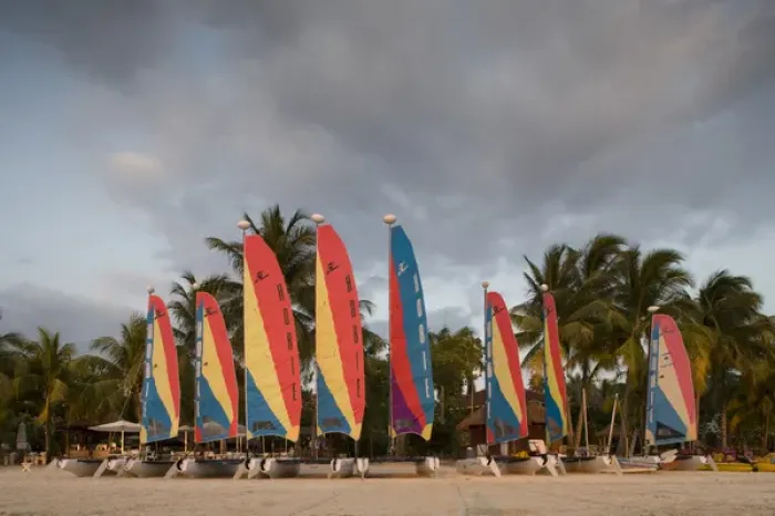 Framed Print : Jamaica, Negril, Setting sun lights row of sailboats at tourist resort along white Framed Print : Jamaica, Negril, Setting sun lights row of sailboats at tourist resort along white