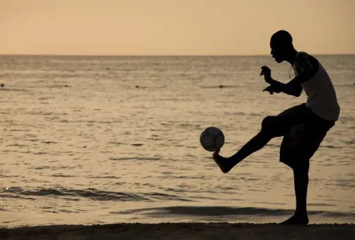 Framed Print : Jamaica, Negril, Silhouette of young men playing soccer along Caribbean Sea Framed Print : Jamaica, Negril, Silhouette of young men playing soccer along Caribbean Sea