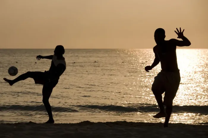 Framed Print : Jamaica, Negril, Silhouette of young men playing soccer along Caribbean Sea Framed Print : Jamaica, Negril, Silhouette of young men playing soccer along Caribbean Sea