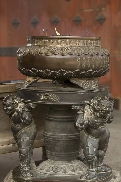 Japan, Honshu island, Nara, bronze urn where worshippers light incense at the entrance