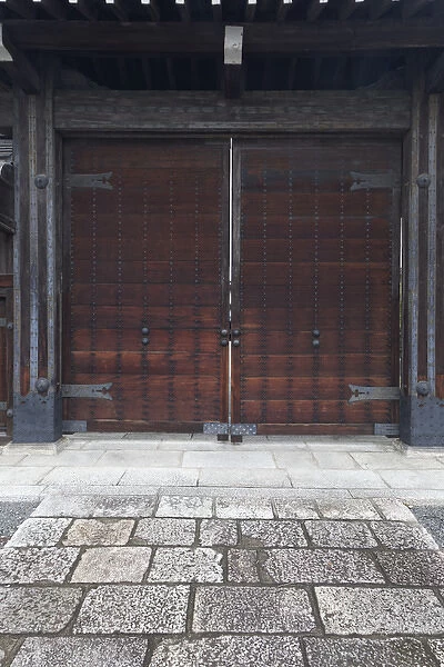 Japan, Kyoto. Large double wooden doors on building