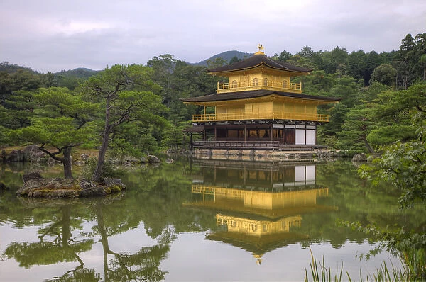 Japan, Kyoto. Temple of the Golden Pavilion reflects in pond