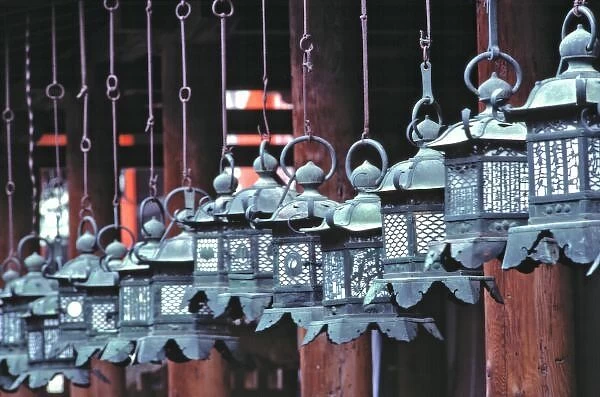 Japan, Nara Pref. Nara. Intricately-carved metal lanterns hang in Kasuga Shrine, in Nara, Japan