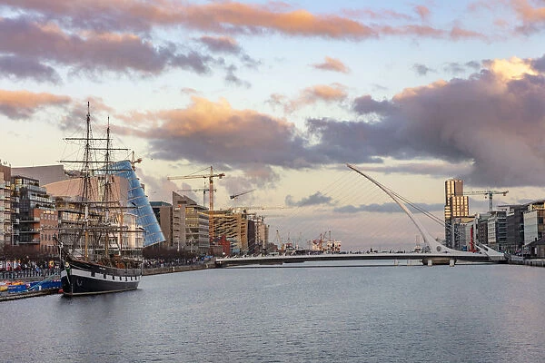 Jeanie Johnston Tall Ship and Samuel Beckett Bridge over the River Liffey in downtown Dublin