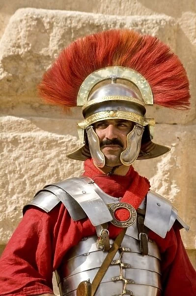 Jordan, Jerash. Historical reenactor in uniform of Roman soldier of 2, 000 years ago