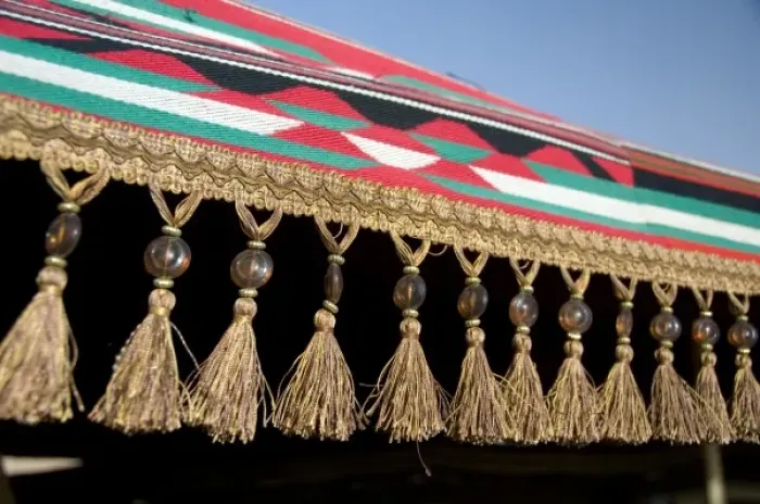 Framed Print : Jordan, Wadi Rum. Traditional Bedouin tent cover with beaded tassels