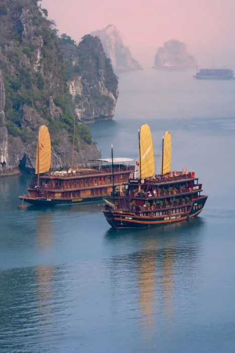 Framed Print : Junk boat and karst islands in Halong Bay, UNESCO World Heritage site Framed Print : Junk boat and karst islands in Halong Bay, UNESCO World Heritage site