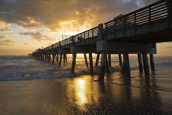 Juno Beach, Florida, Juno Beach Pier at sunrise with high surf