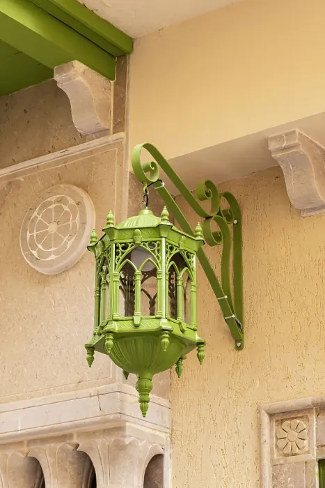 Framed Print : Kairouan, Tunisia. A green metal lamp hanging from a building