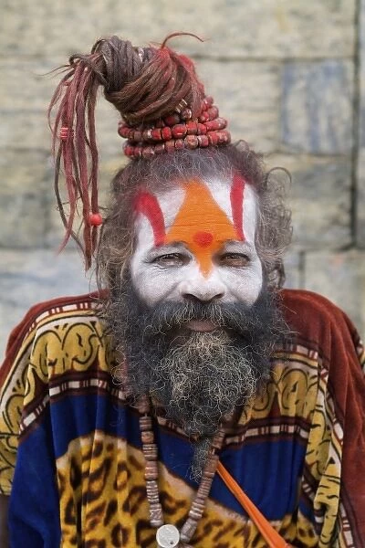 Kathmandu Nepal religious man who is a character painted in costume near river at