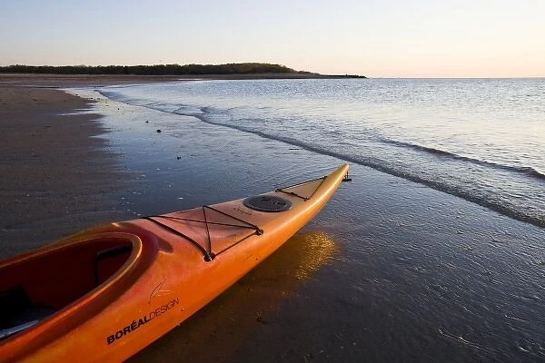 A kayak on the beach at dawn at the Shifting Lots Preserve in Plymouth, Massachusetts