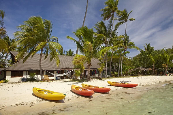 Kayak on the beach, and waterfront bure, Plantation Island Resort, Malolo Lailai Island