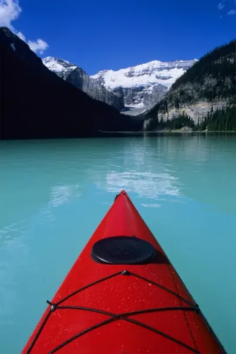 Framed Print : Kayak on Lake Louise below Mount Victoria in the Canadian Rockies; Banff National Park; Alberta