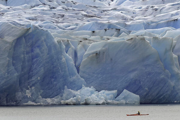 Kayaker exploring Grey Lake and massive Grey Glacier, Torres del Paine National Park