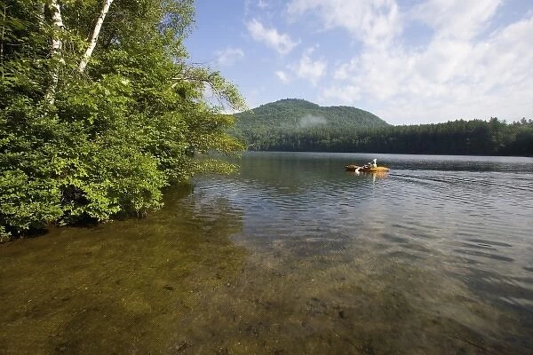 A kayaker on Mirror Lake near the Hubbard Brook Experimental Forest in Woodstock, NH