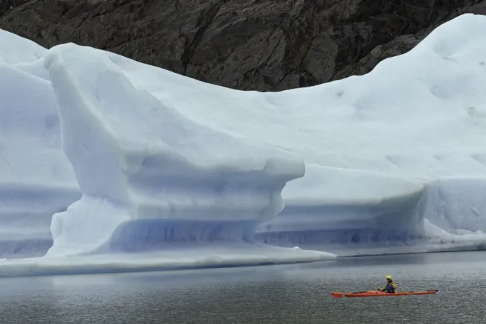 Framed Print : Kayakers exploring Grey Lake amid large iceberg, Torres del Paine National Park