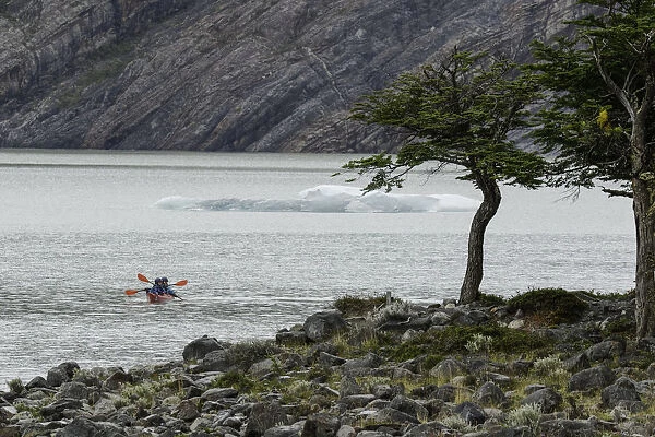 Kayakers exploring Grey Lake, Torres del Paine National Park, Chile, Patagonia