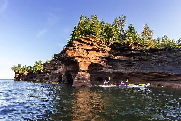 Kayakers exploring the sea caves of Devils Island in the Apostle Islands National Lakeshore