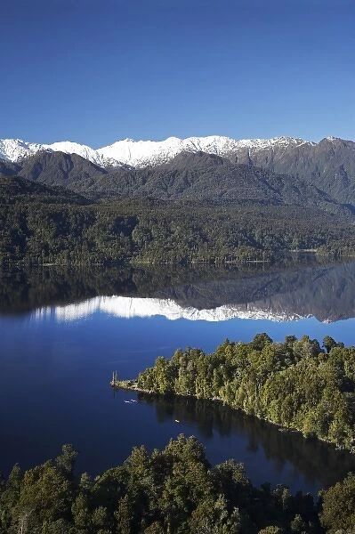 Kayakers, Lake Mapourika, and Southern Alps, West Coast, South Island, New Zealand