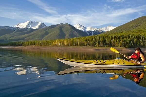 Kayaking on Hungry Horse Reservoir with Great Northern Mountain in background in