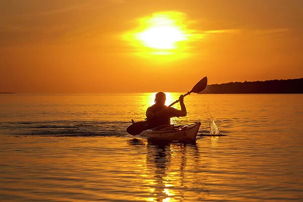 Kayaking at sunset in the Apostle Islands National Lakeshore of Lake Superior near Bayfield