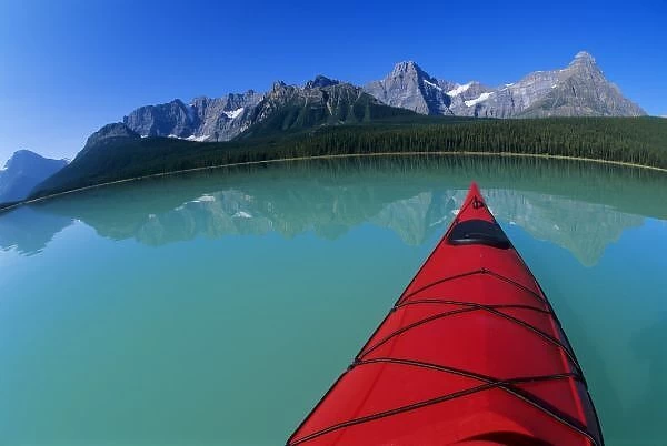 Kayaking on Waterfowl Lake below Howse Peak along the Icefields Parkway in Banff National Park