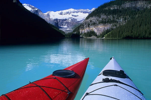 Kayaks on Lake Louise below Mount Victoria in the Canadian Rockies; Banff National Park; Alberta
