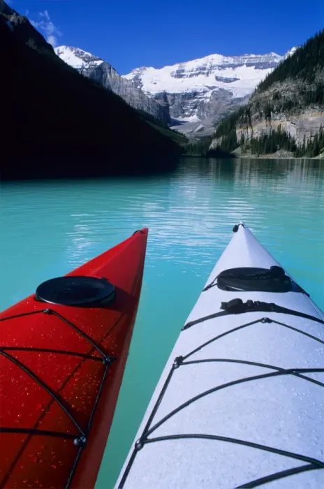 Framed Print : Kayaks on Lake Louise below Mount Victoria in the Canadian Rockies; Banff National Park; Alberta