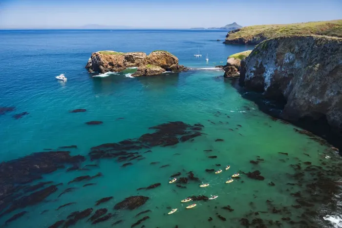 Framed Print : Kayaks and sailboats at Scorpion Cove, Santa Cruz Island, Channel Islands National Park