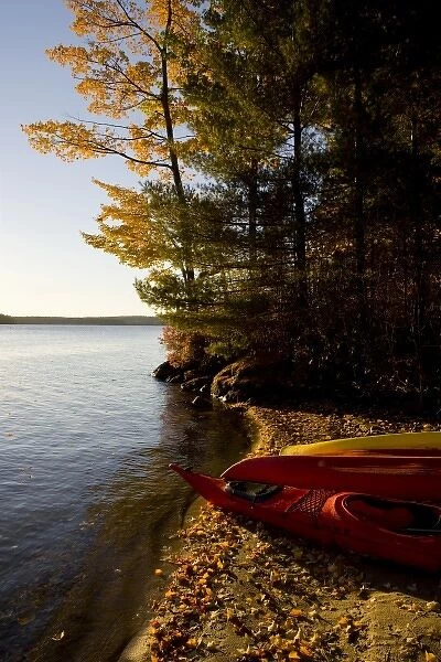 Kayaks on the shore on Lake Winnipesauke at Oliver Lodge in Meredith, New Hampshire