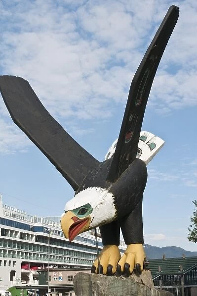 Ketchikan, Alaska. Cruise ship and Bald eagle totem near cruise terminal Ketchikan