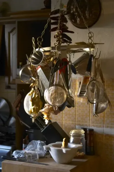 Framed Print : Kitchen utensils hanging on hooks in the Provence kitchen: raper, stainer, sieves Framed Print : Kitchen utensils hanging on hooks in the Provence kitchen: raper, stainer, sieves