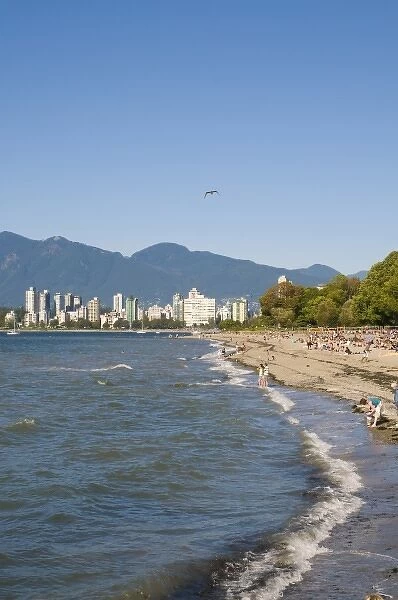 Kitsilano Beach park overlooking English Bay and the skyline of downtown Vancouver, BC, Canada