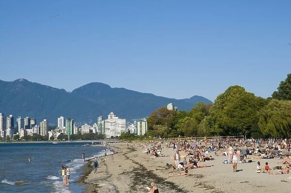 Kitsilano Beach park and swimming pool overlook English Bay and the skyline of downtown Vancouver