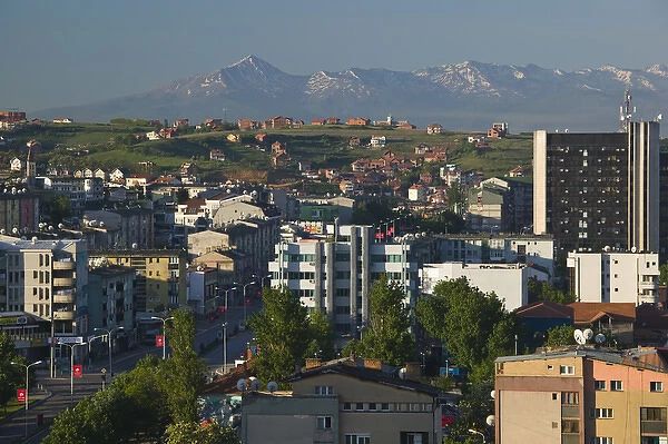 KOSOVO, Prishtina. Downtown Prishtina and the Albanian Mountains to the South  /  Morning