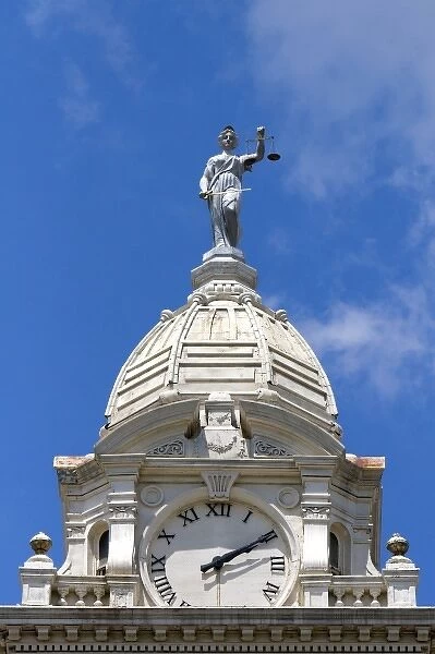 Lady Justice depicted with a sword and scales atop the Ionia County Courthouse in Ionia, Michigan
