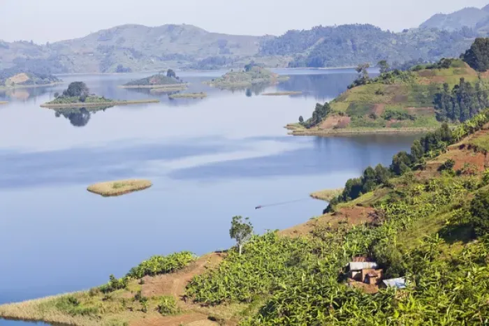 Framed Print : Lake Mutanda near Kisoro in Uganda. On the shoreline the land is cultivated, very Framed Print : Lake Mutanda near Kisoro in Uganda. On the shoreline the land is cultivated, very