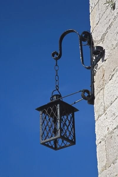 Lamp hanging at corner of building, Hvar Island, Croatia