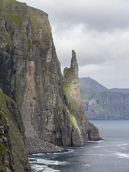 The landmark Trollkonufingur in the cliffs of the island of Vagar, part of the Faroe Islands