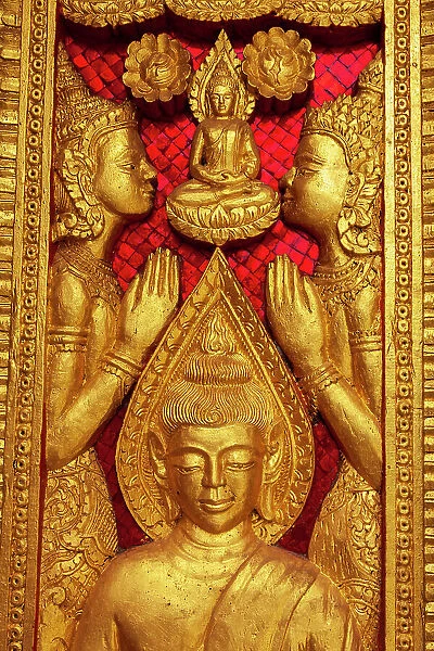 Laos, Luang Prabang. Haw Pha Bang, royal temple on the grounds of the Royal Palace Museum. Carved panel on wall