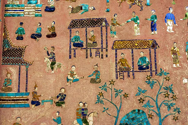 Laos, Luang Prabang. Detail of mosaic decorations depicting people on the side of a
