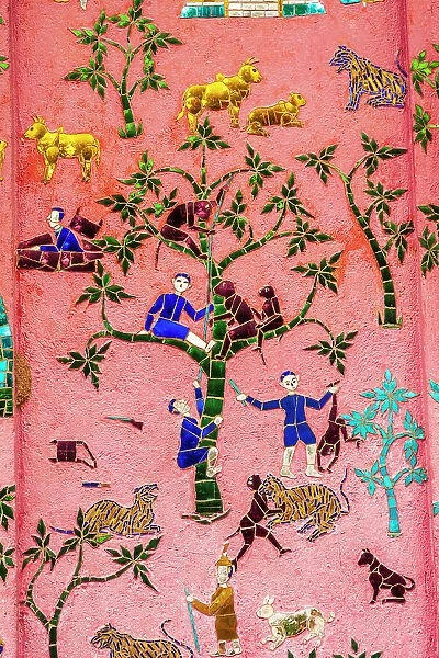 Laos, Luang Prabang. Mosaic mural depicting people and animals