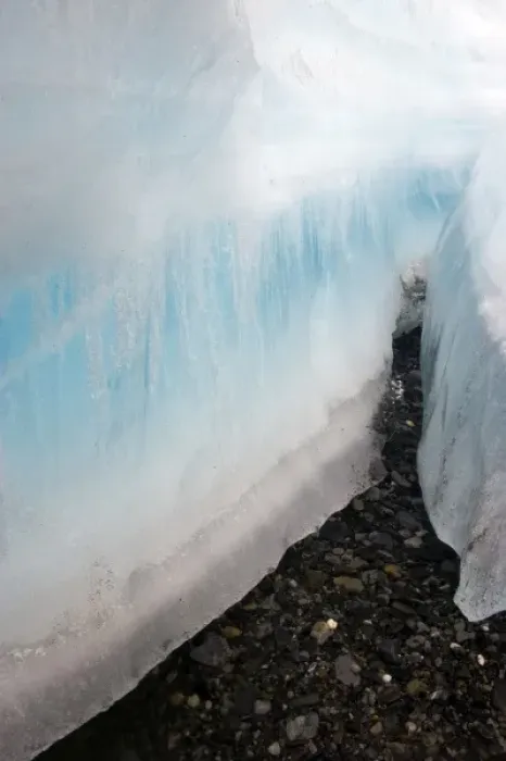 Framed Print : A large crevice in the arctic aufeis revealing laminations of ice above the dark Framed Print : A large crevice in the arctic aufeis revealing laminations of ice above the dark