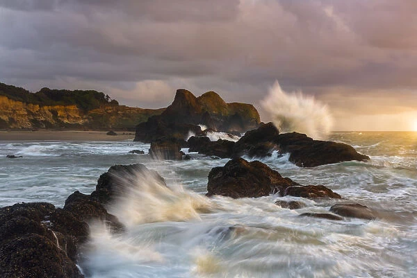 Large waves crashing against the sea stacks along the beach of Seal Rock