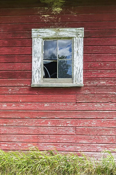 Latah, Washington State, USA. Window on the wall of an old red barn